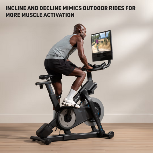 Person using a stationary bike with a screen displaying an outdoor scene, emphasizing muscle activation.