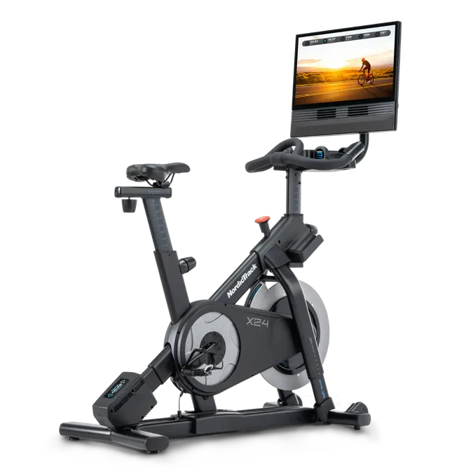 Exercise bike with a screen displaying a cycling scene on a white background